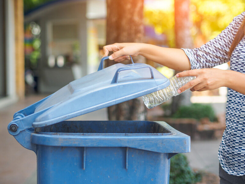 bottle going into blue bin