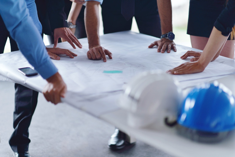 engineers looking at blueprint