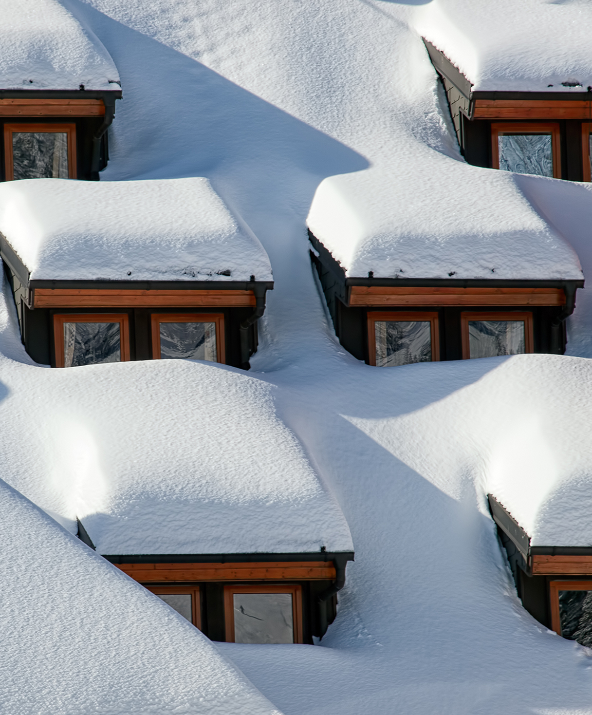 Deep snow covered roof of house