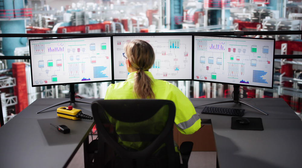 Plant managers reviewing energy data to reduce carbon emissions